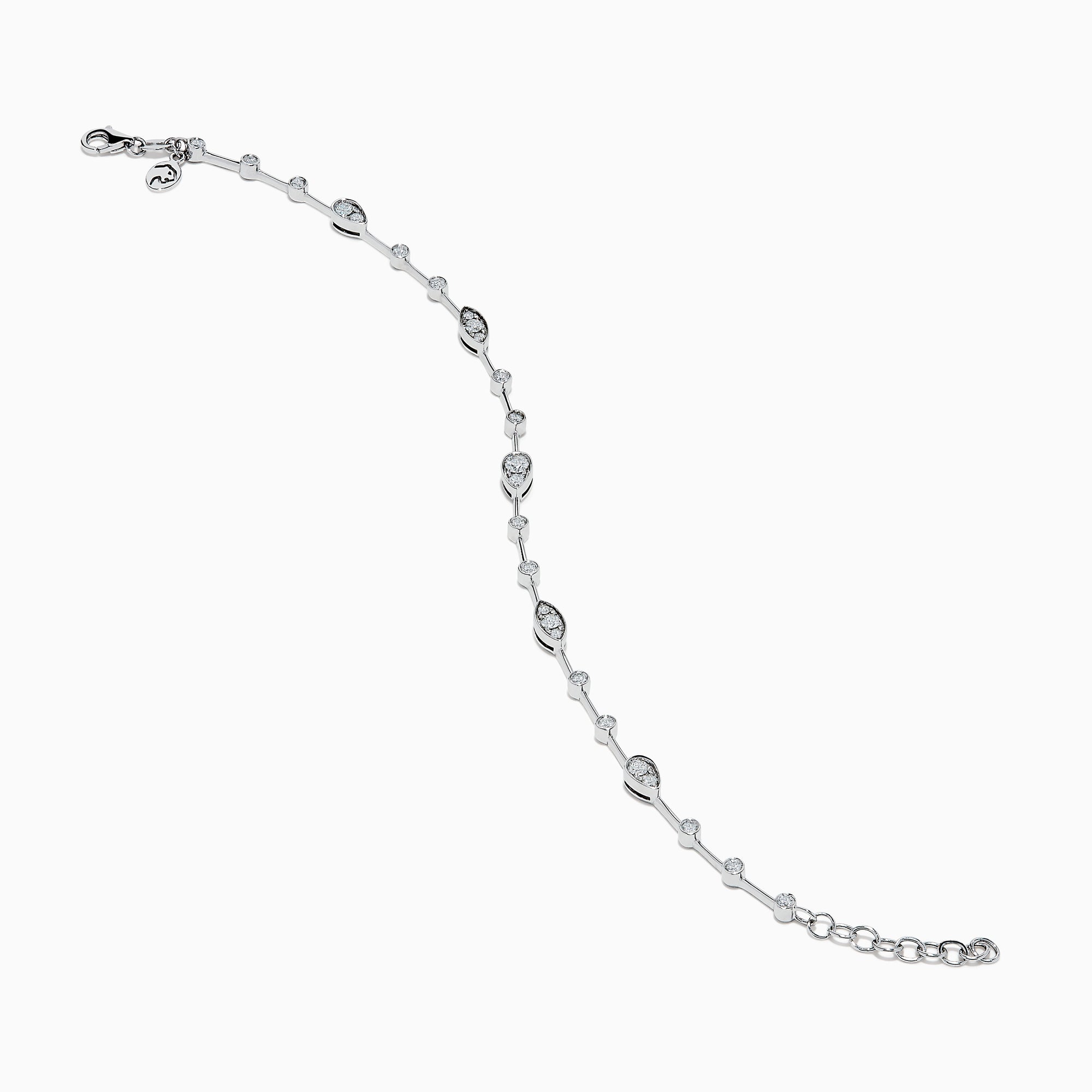 The 14K White Gold Diamond Station Bracelet features small round and teardrop-shaped diamonds spaced along a thin chain, showcased on a white background.