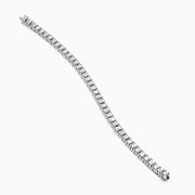 The 18K White Gold Diamond Tennis Bracelet features a continuous row of square-cut diamonds in an elegant design set against a white background.