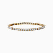 The Pave Classica 14K Two-Tone Gold Diamond Tennis Bracelet, featuring 0.51 TCW of diamonds in a sleek single-row design, is displayed on a white background.