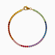 The Watercolors 14K Yellow Gold Multi Sapphire Tennis Bracelet showcases a vibrant, rainbow-gradient of sapphires set in a continuous line for a colorful and elegant look.
