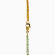 The Watercolors 14K Yellow Gold Multi Sapphire Tennis Bracelet showcases a vibrant, rainbow-gradient of sapphires set in a continuous line for a colorful and elegant look.