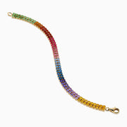 The Watercolors 14K Yellow Gold Multi Sapphire Double Lined Tennis Bracelet showcases two rows of sapphires in a vibrant rainbow gradient, with colors flowing from red and orange to yellow, green, blue, and purple.