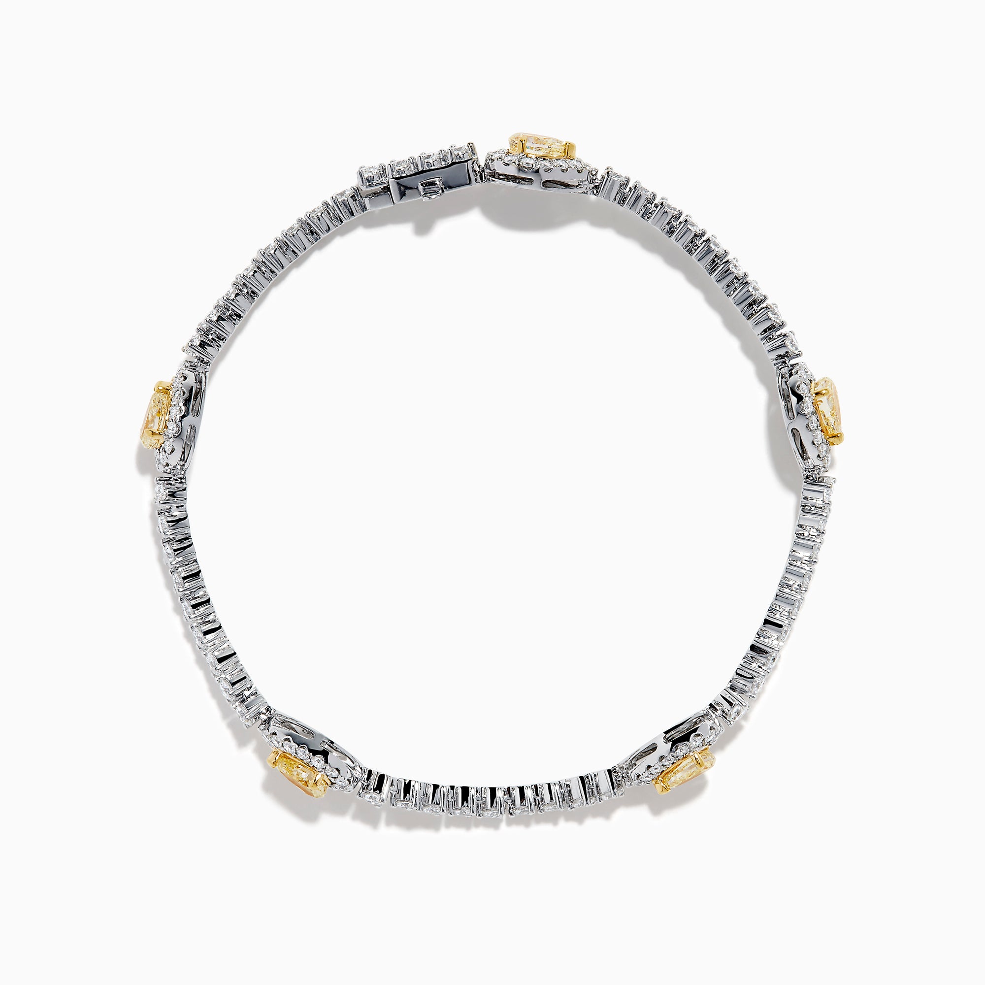 The 18K Two Tone Gold Yellow and White Diamond Station Tennis Bracelet features sparkling white diamonds and three striking yellow and white diamond stations, each outlined by smaller diamonds in an elegant, detailed design.