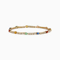 The Watercolors 14K Yellow Gold Multi Sapphire and Diamond Tennis Bracelet features a delicate band with alternating white diamonds and green, blue, red, yellow, and orange sapphires in a symmetrical design.