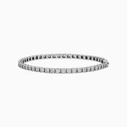 The 14K White Gold Diamond Miracle Setting 1.00ct Tennis Bracelet features a continuous row of round, sparkling white diamonds set in a slim, polished 14K white gold band and is displayed on a white background.