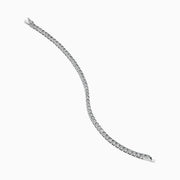 The 14K White Gold Diamond Miracle Setting 1.00ct Tennis Bracelet features a continuous row of round, sparkling white diamonds set in a slim, polished 14K white gold band and is displayed on a white background.