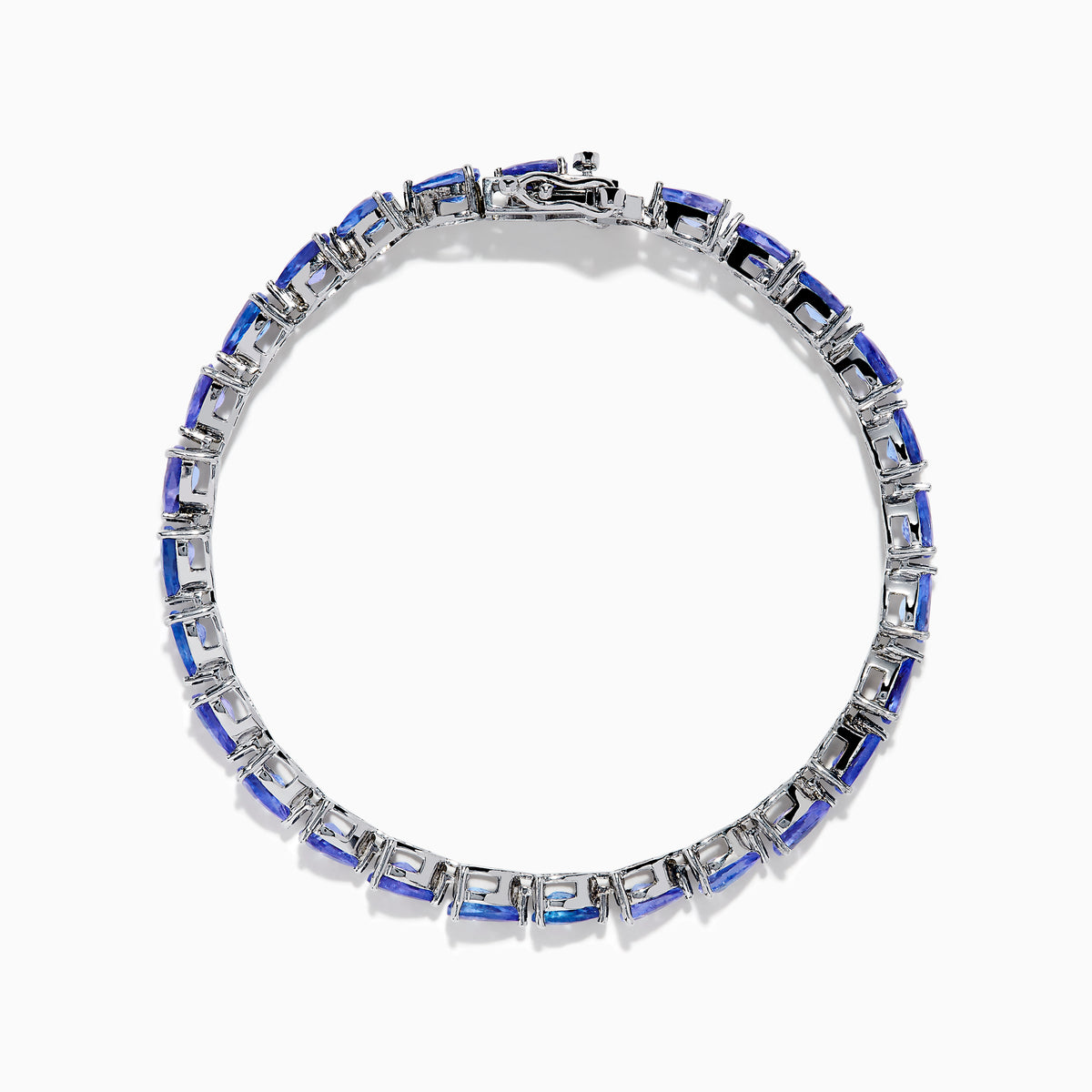 The Nahla 925 Sterling Silver Pear Tanzanite Tennis Bracelet showcases a continuous row of pear-shaped tanzanite gemstones, each set in individual prongs, and secured with a sturdy clasp.