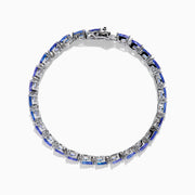 The Nahla 925 Sterling Silver Pear Tanzanite Tennis Bracelet showcases a continuous row of pear-shaped tanzanite gemstones, each set in individual prongs, and secured with a sturdy clasp.