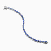 The Nahla 925 Sterling Silver Pear Tanzanite Tennis Bracelet showcases a continuous row of pear-shaped tanzanite gemstones, each set in individual prongs, and secured with a sturdy clasp.