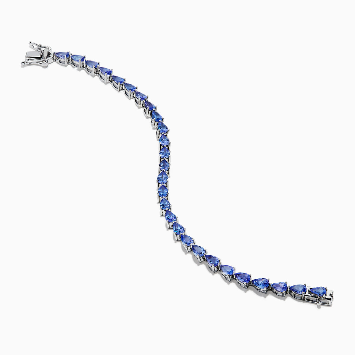 The Nahla 925 Sterling Silver Pear Tanzanite Tennis Bracelet showcases a continuous row of pear-shaped tanzanite gemstones, each set in individual prongs, and secured with a sturdy clasp.