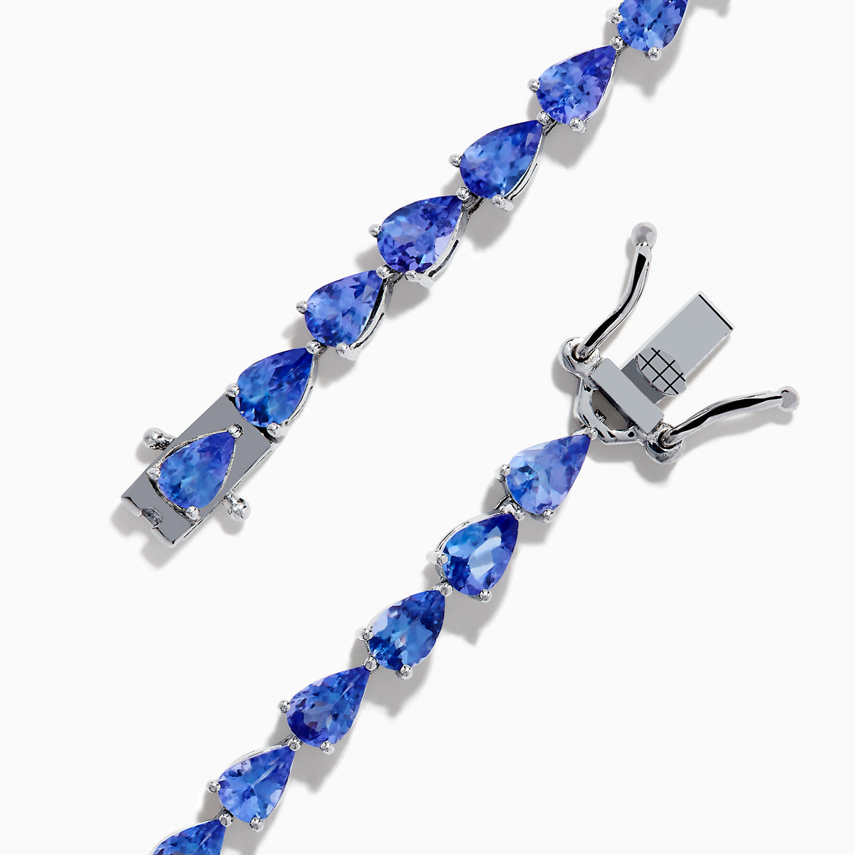 The Nahla 925 Sterling Silver Pear Tanzanite Tennis Bracelet showcases a continuous row of pear-shaped tanzanite gemstones, each set in individual prongs, and secured with a sturdy clasp.
