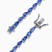 The Nahla 925 Sterling Silver Pear Tanzanite Tennis Bracelet showcases a continuous row of pear-shaped tanzanite gemstones, each set in individual prongs, and secured with a sturdy clasp.