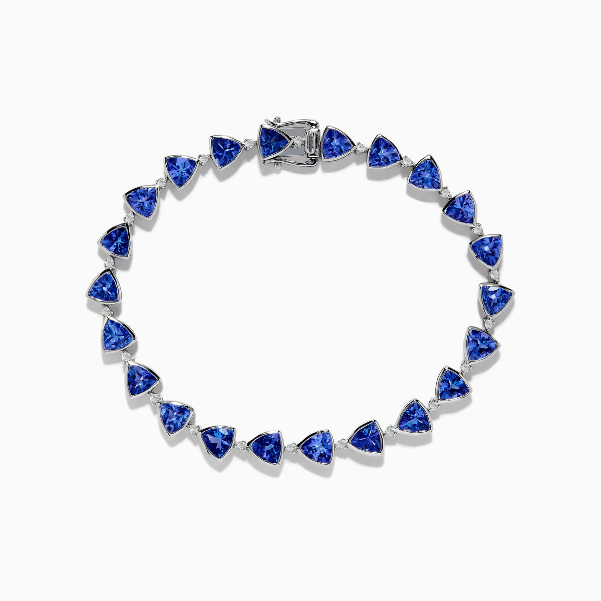The Nahla Siri Sterling Silver Tanzanite and Diamond Tennis Bracelet features triangular blue gemstones and diamonds set in sterling silver, evenly spaced and connected, shown against a white background.