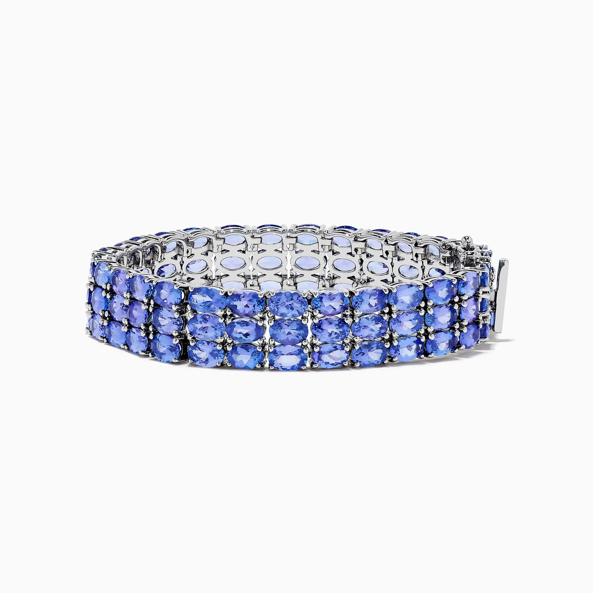 The Nahla Siri Sterling Silver Oval 3 Row Tanzanite Bracelet features three rows of oval tanzanite stones set in sterling silver, beautifully showcased against a white background.