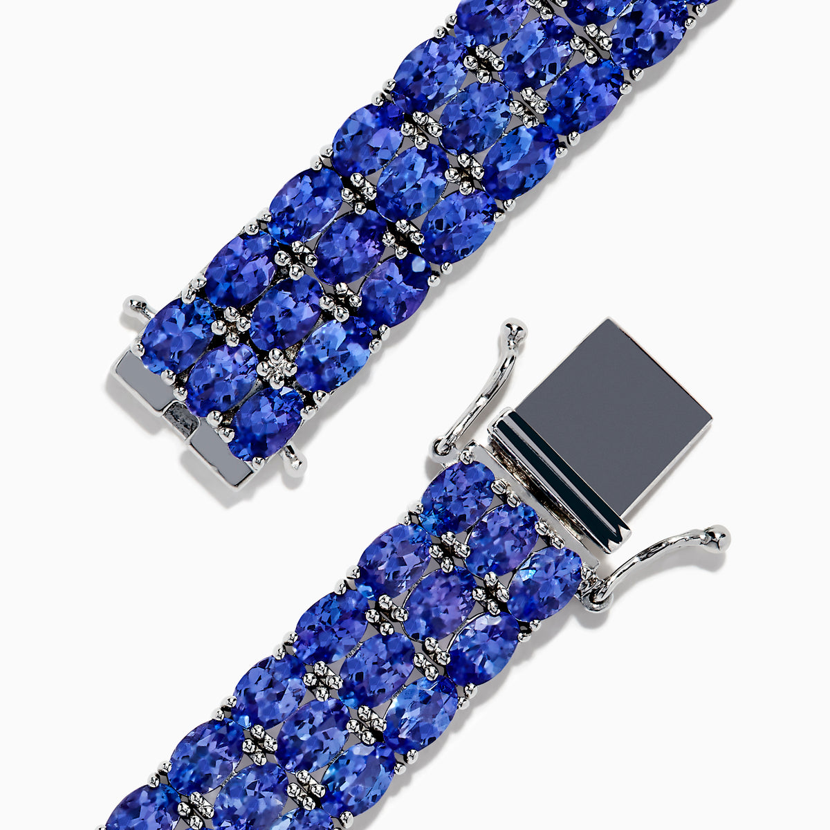 The Nahla Siri Sterling Silver Oval 3 Row Tanzanite Bracelet features three rows of oval tanzanite stones set in sterling silver, beautifully showcased against a white background.
