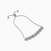 The 925 Sterling Silver Diamond Bouquet Bolo Bracelet features sparkling flower-shaped diamond clusters and an adjustable sliding clasp for a perfect fit.