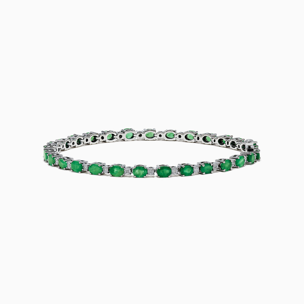 The 925 Sterling Silver Emerald and Diamond Tennis Bracelet features a continuous row of oval green gemstones and diamonds, each prong-set for elegance, reminiscent of an emerald bracelet, displayed on a white background.