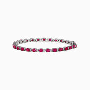 The 925 Sterling Silver Ruby and Diamond Tennis Bracelet features a continuous row of round rubies and diamonds in prong settings, elegantly displayed in a circular shape against a white background.