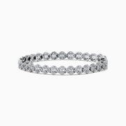 The 925 Sterling Silver Diamond Cluster Tennis Bracelet showcases two rows of round, sparkling diamonds in a repeating cluster pattern, displayed on a white background.