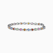 The 925 Sterling Silver Multi Sapphire and Diamond Bezel Bracelet features round, bezel-set multicolored sapphires and diamonds evenly spaced along the band, shown on a white background.