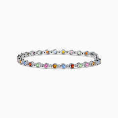 The 925 Sterling Silver Multi Sapphire and Diamond Bezel Bracelet features round, bezel-set multicolored sapphires and diamonds evenly spaced along the band, shown on a white background.