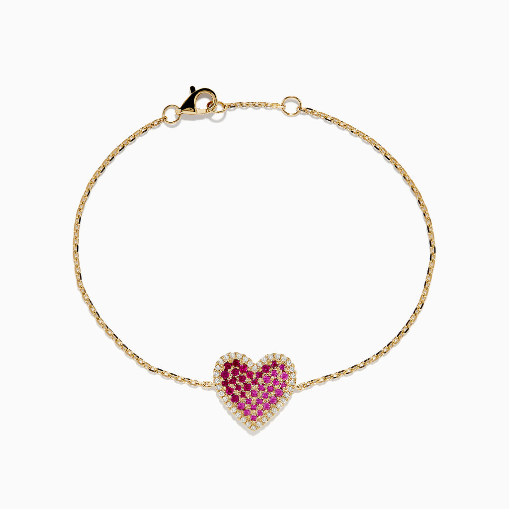 The Novelty 14K Yellow Gold Ruby, Pink Sapphire and Diamond Heart Bracelet features a heart-shaped pendant with pink sapphires, rubies, and diamonds on a delicate gold chain, shown against a plain white background.