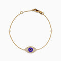 Elegant 14K yellow gold bracelet featuring a purple enamel evil eye charm accented with black and white diamonds—an eye-catching novelty piece perfect for everyday protection.