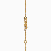 Elegant 14K yellow gold bracelet featuring a purple enamel evil eye charm accented with black and white diamonds—an eye-catching novelty piece perfect for everyday protection.