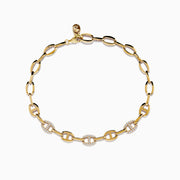 The Doro 14K Yellow Gold Anchor Chain Diamond Bracelet features oval links, some set with sparkling diamonds totaling 0.27 TCW, and is shown on a white background.