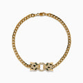 The Signature 14K Yellow Gold Diamond Panther Cuban Chain Bracelet features two opposing panther head clasps with small white and green gemstones, joined by a circular link, shown on a white background.