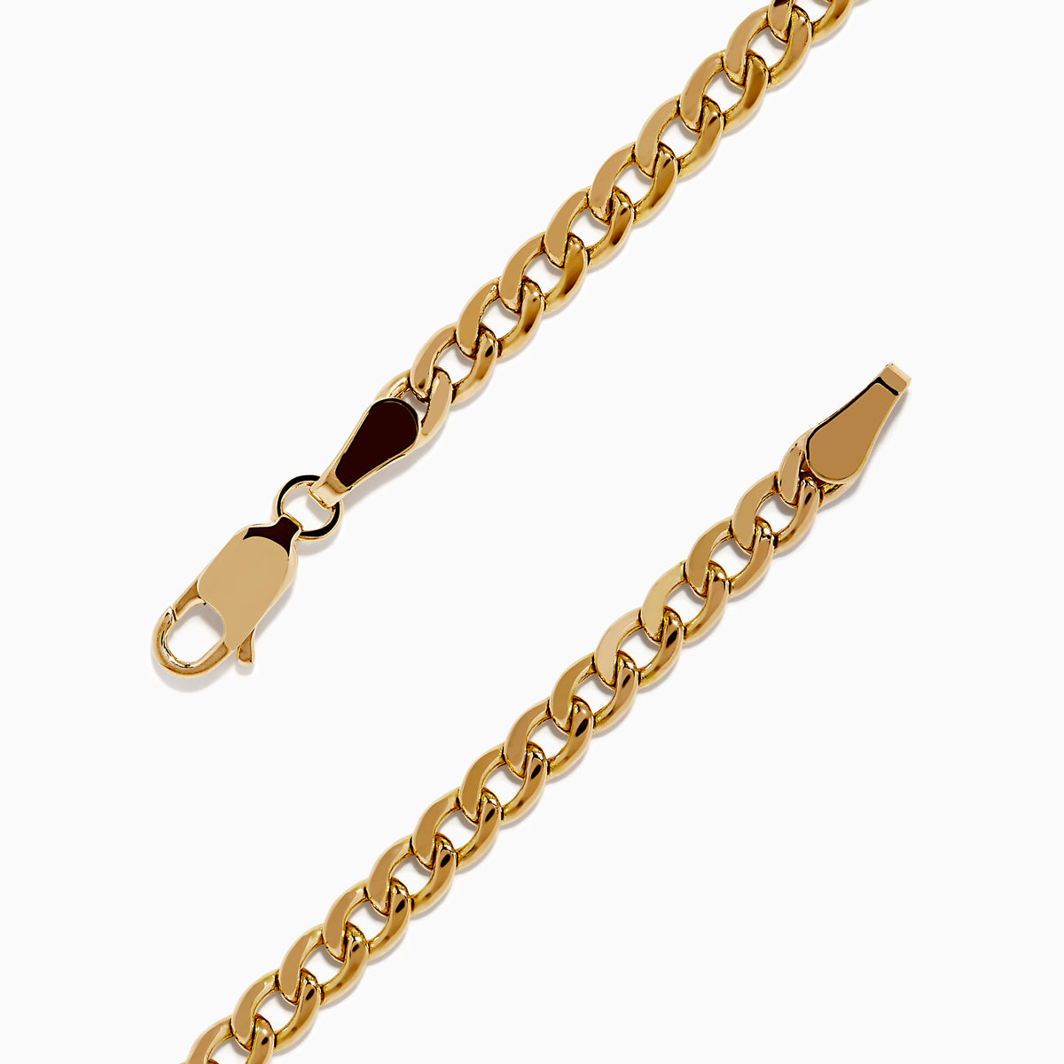 The Signature 14K Yellow Gold Black and White Diamond Panther Bracelet showcases two panther heads with green eyes and diamond accents, joined by black-encrusted circular links.
