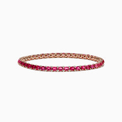 A slim 14k rose gold tennis bracelet featuring oval pink tourmalines and rubies totaling 6.56 TCW, set in a single row and displayed on a white background.