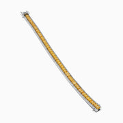 The Canare 14K White and Yellow Gold Yellow and White Diamond Bracelet features a row of yellow diamonds framed by white diamonds, set in elegant white and yellow gold.