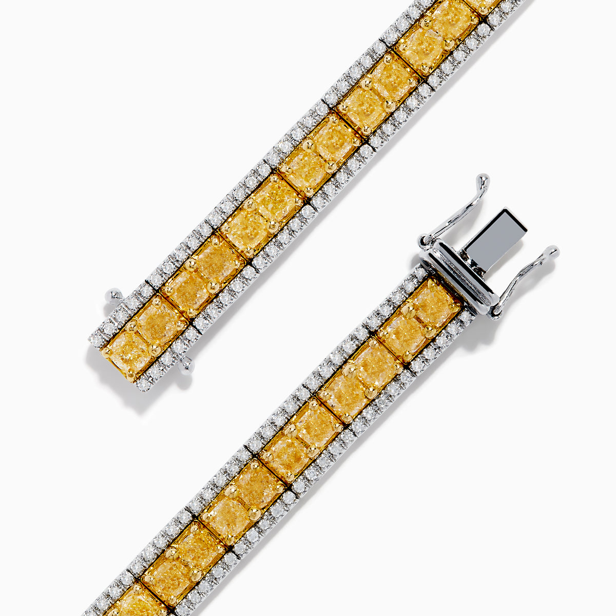 The Canare 14K White and Yellow Gold Yellow and White Diamond Bracelet features a row of yellow diamonds framed by white diamonds, set in elegant white and yellow gold.