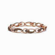 The 14K Rose Gold Espresso and White Diamond Tennis Bracelet 3.33 TCW features alternating links encrusted with sparkling espresso and white diamonds, creating an elegant, shimmering pattern against a rose gold setting.