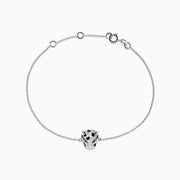 The Signature 14K White Gold Diamond and Emerald Panther Bracelet features a delicate panther head charm with emerald and diamond accents, shown on a plain white background.