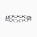 The 14K White Gold Diamond Oval Chain-Link Bracelet showcases a modern and elegant design, featuring alternating smooth and diamond-encrusted oval links, displayed on a white background.