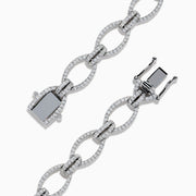 The 14K White Gold Diamond Oval Chain-Link Bracelet showcases a modern and elegant design, featuring alternating smooth and diamond-encrusted oval links, displayed on a white background.