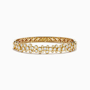The Lab Grown Round Diamond 2.88ct Bubble Bangle in 14K Yellow Gold features clustered round diamonds and an intricate open lattice inner design.