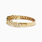 The Lab Grown Round Diamond 2.88ct Bubble Bangle in 14K Yellow Gold features clustered round diamonds and an intricate open lattice inner design.