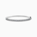 The 925 Sterling Silver Diamond Bangle features two rows of small, round diamonds set along the front, displayed on a white background.