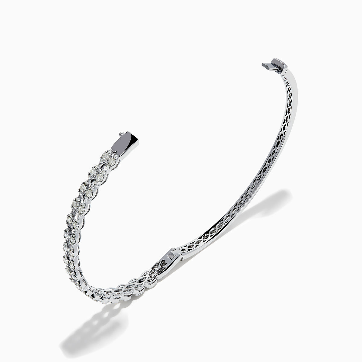 The 14K White Gold Diamond Bangle features two rows of diamonds and a delicate openwork pattern on the inner side.