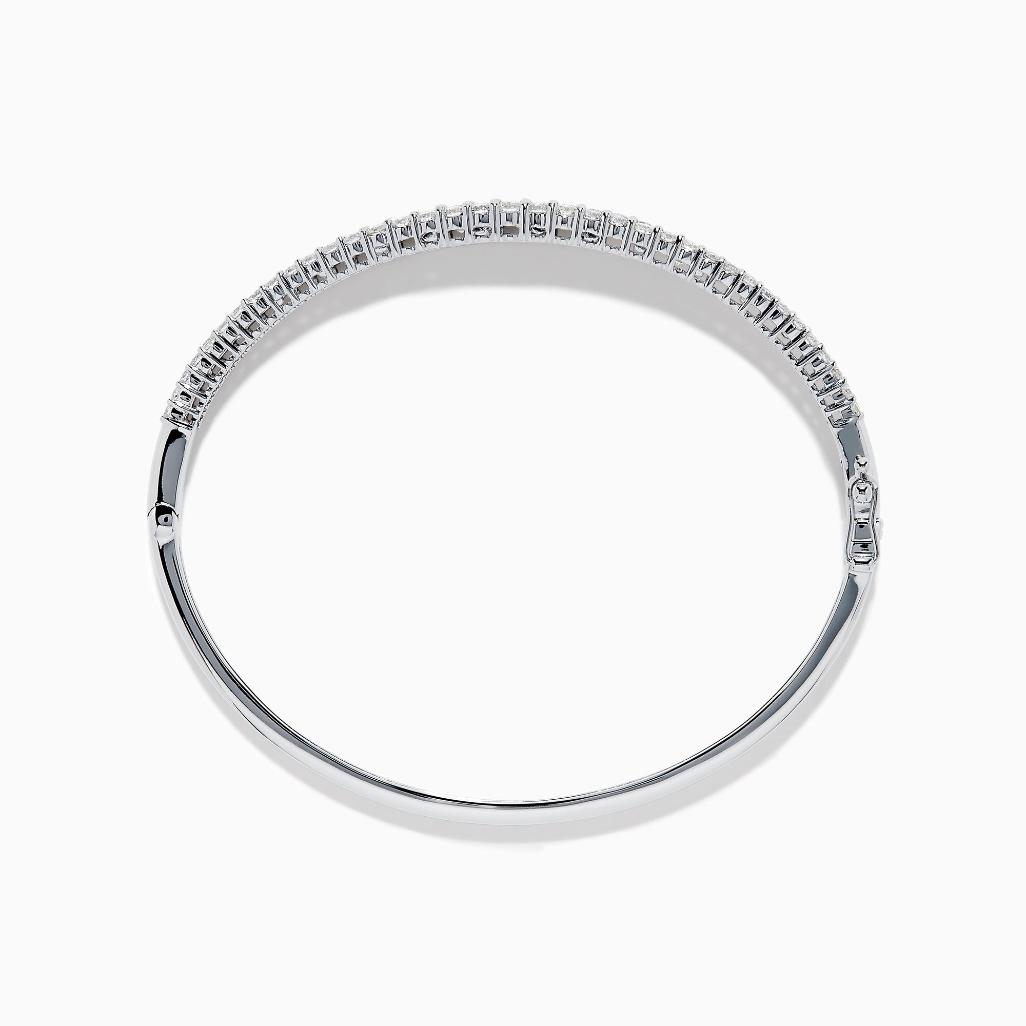 The Classique 14K White Gold Diamond Bangle features two rows of round diamonds and a central row of baguette-cut diamonds, elegantly set against a plain white background.