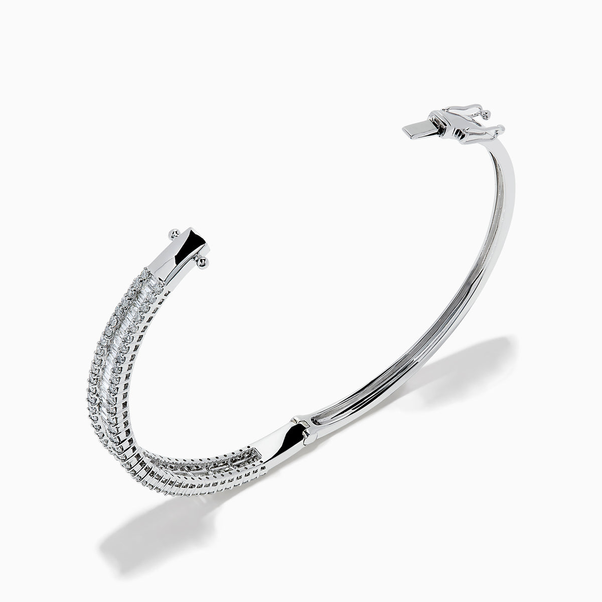 The Classique 14K White Gold Diamond Bangle features two rows of round diamonds and a central row of baguette-cut diamonds, elegantly set against a plain white background.