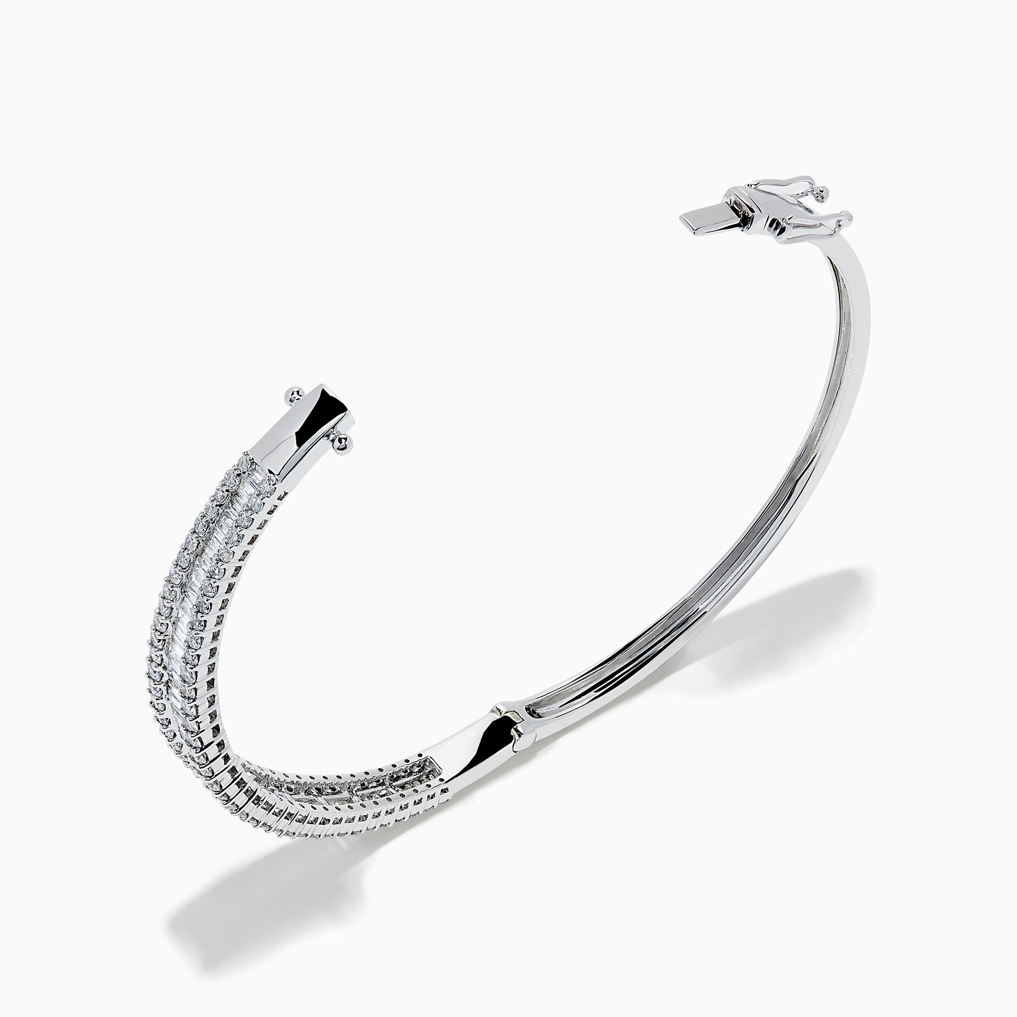 The Classique 14K White Gold Diamond Bangle features two rows of round diamonds and a central row of baguette-cut diamonds, elegantly set against a plain white background.
