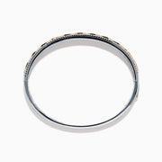 The 14K Two-Tone Gold Pink and White Diamond Bangle features marquise-shaped rose gold accents with pink gemstones, bordered by round white diamonds and an intricate inner openwork design.