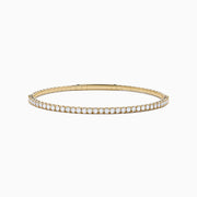 The DOro 14K Yellow Gold Diamond Bangle features a single row of sparkling white diamonds, expertly crafted in radiant yellow gold and elegantly displayed against a white background.