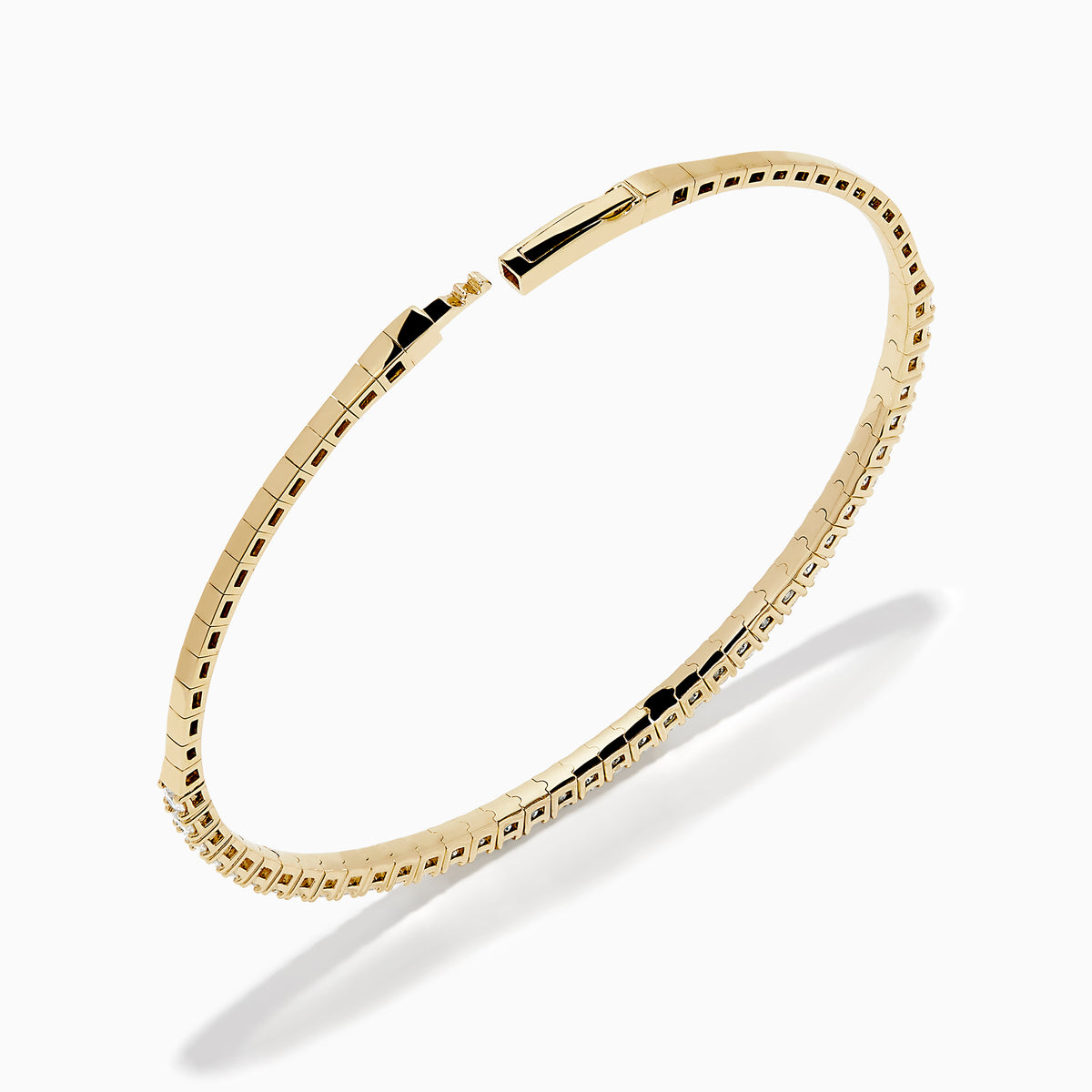 The DOro 14K Yellow Gold Diamond Bangle features a single row of sparkling white diamonds, expertly crafted in radiant yellow gold and elegantly displayed against a white background.