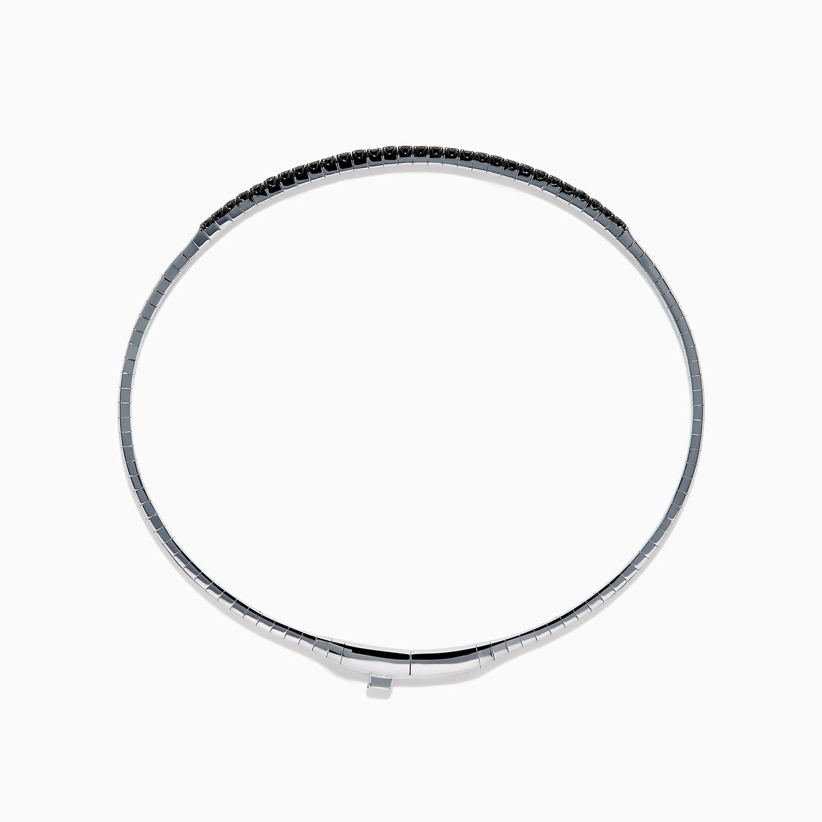 The Caviar 14K White Gold Black Diamond Bangle is a slim silver bracelet adorned with a row of small black diamonds, reminiscent of caviar, displayed on a white background.