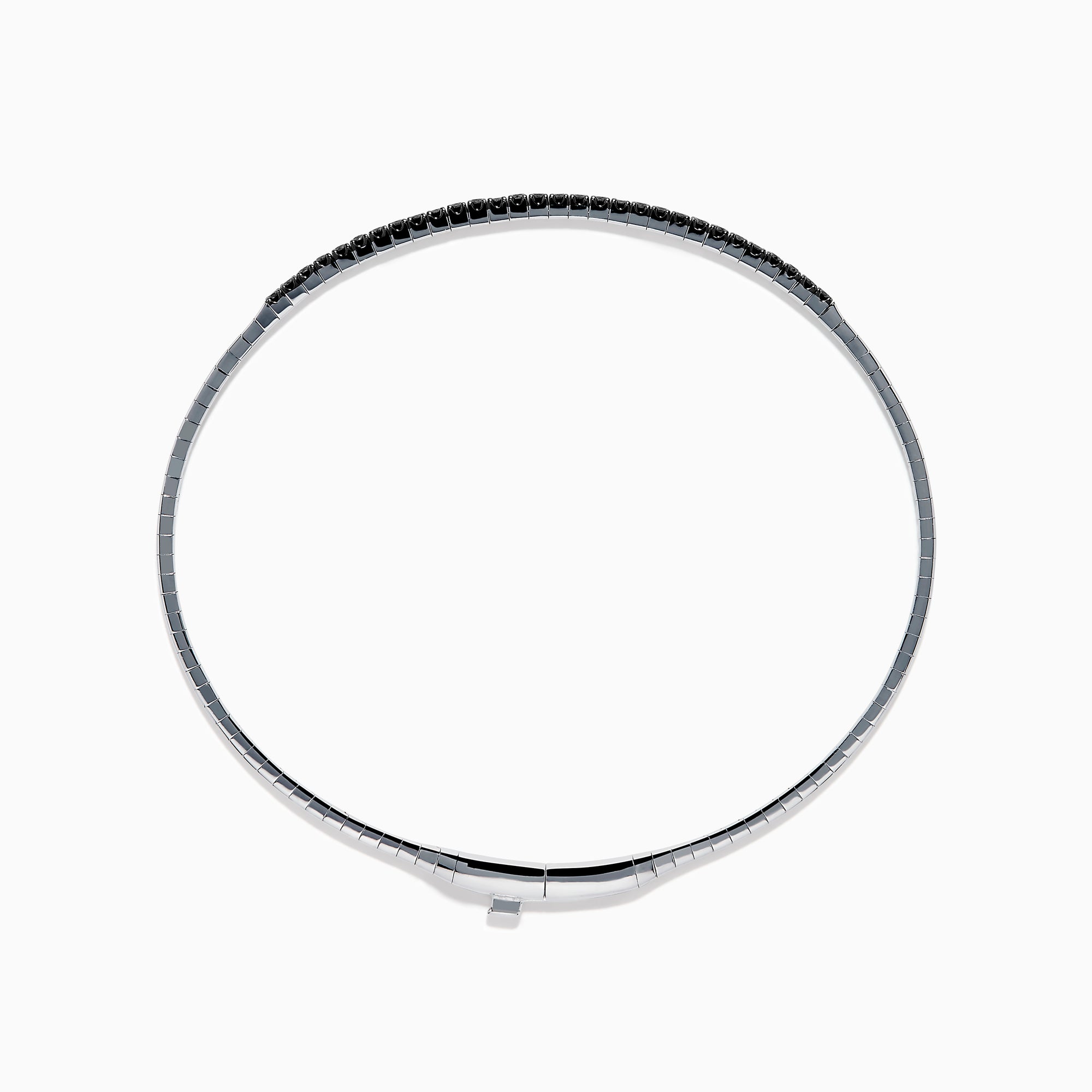 The Caviar 14K White Gold Black Diamond Bangle is a slim silver bracelet adorned with a row of small black diamonds, reminiscent of caviar, displayed on a white background.